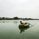 A villager fishes near the Sky City construction site.